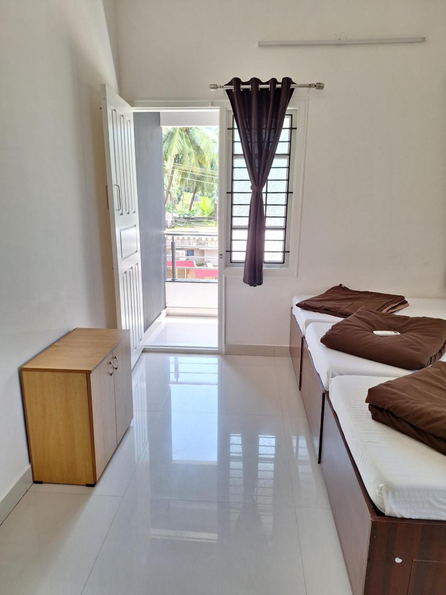 Suvarna Grande Homes Mangalore Værelse billede