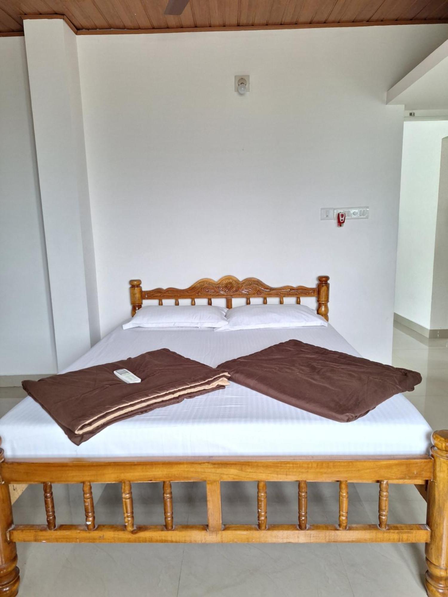 Suvarna Grande Homes Mangalore Værelse billede